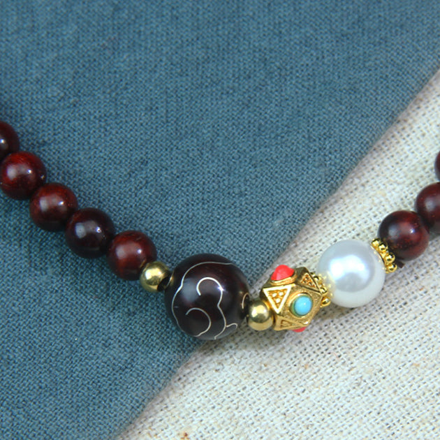 A small-leaf red sandalwood bracelet with silver inlaid around the clouds