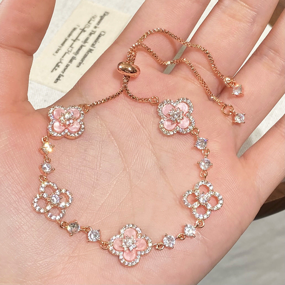 Clover micro-inlaid zircon hollowed-out bracelet