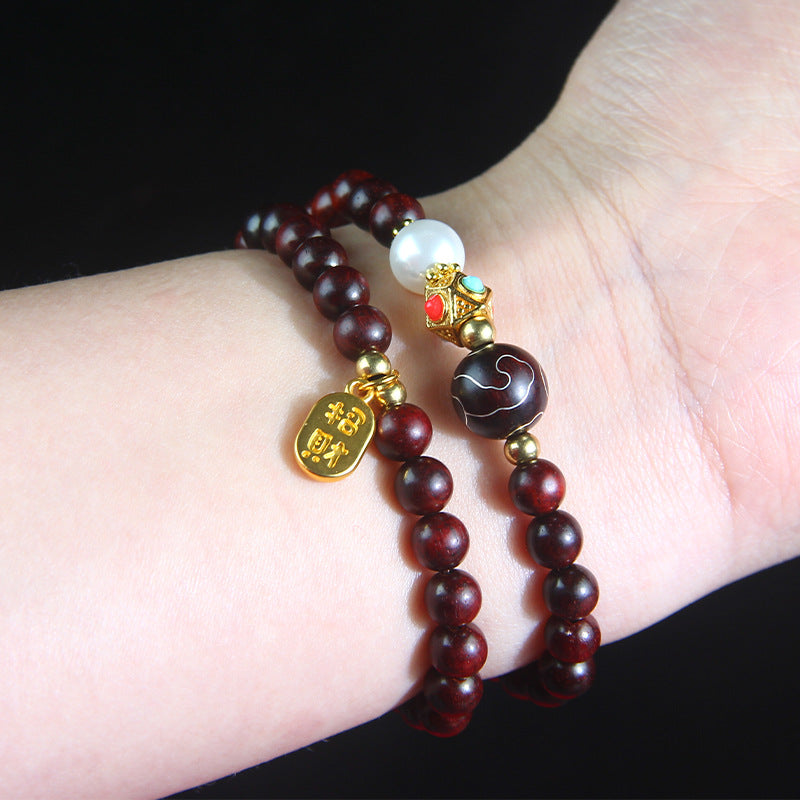 A small-leaf red sandalwood bracelet with silver inlaid around the clouds