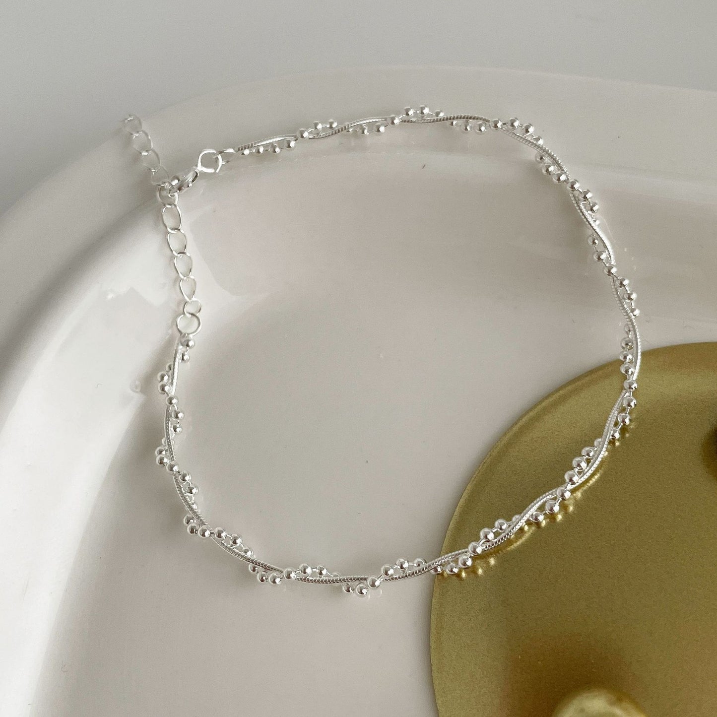 The S925 silver woven double-layer wound bracelet glitters with round beads