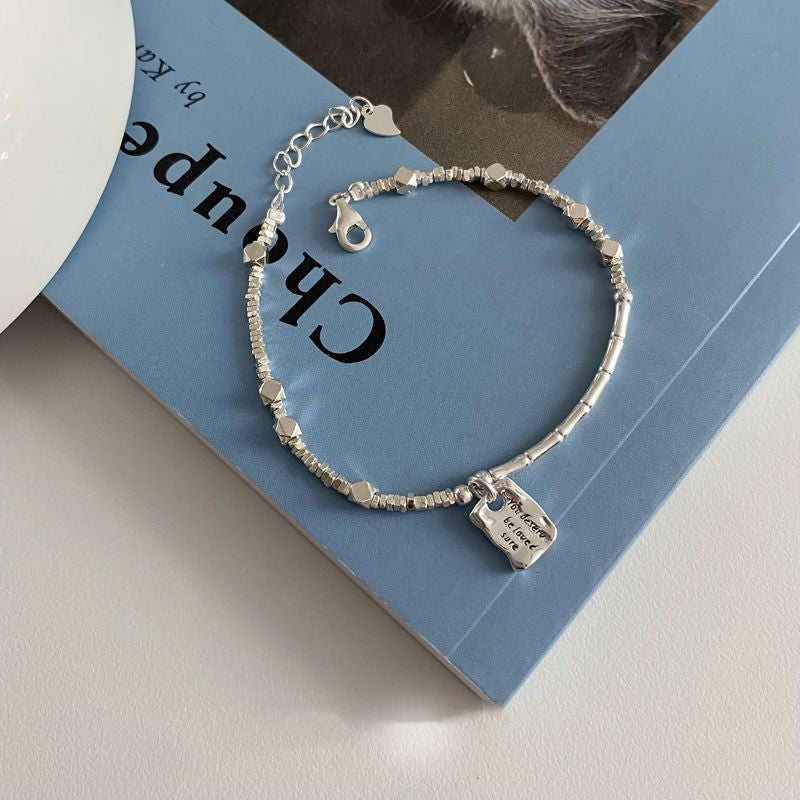 A few pairs of irregularly broken silver bracelets with heart-shaped square brand bamboo joints