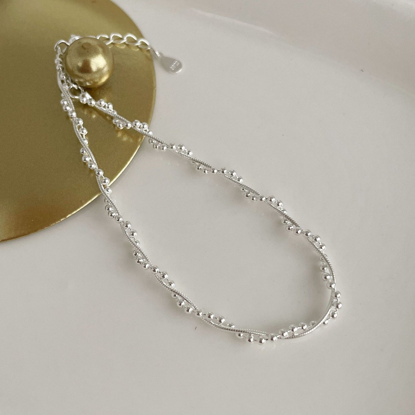 The S925 silver woven double-layer wound bracelet glitters with round beads