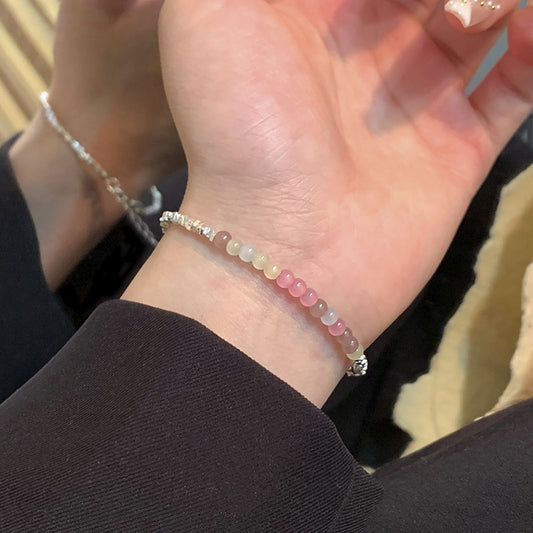 A string of beads is made by stacking small pieces of silver