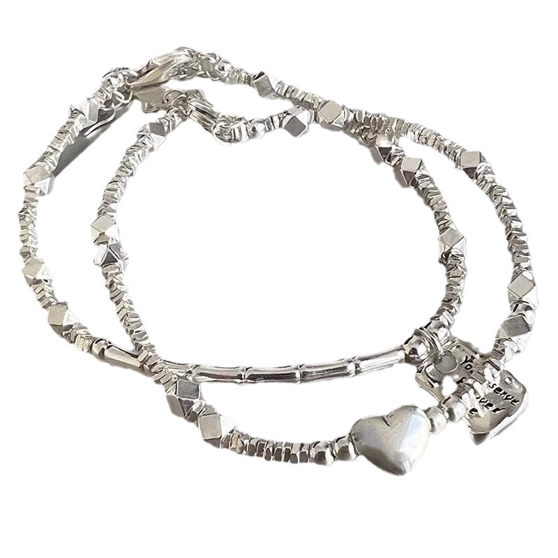 A few pairs of irregularly broken silver bracelets with heart-shaped square brand bamboo joints