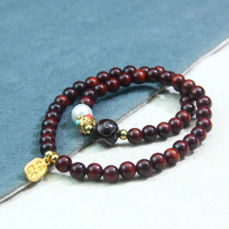 A small-leaf red sandalwood bracelet with silver inlaid around the clouds