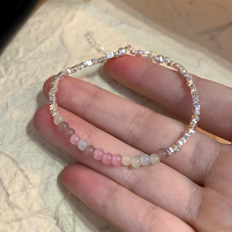 A string of beads is made by stacking small pieces of silver