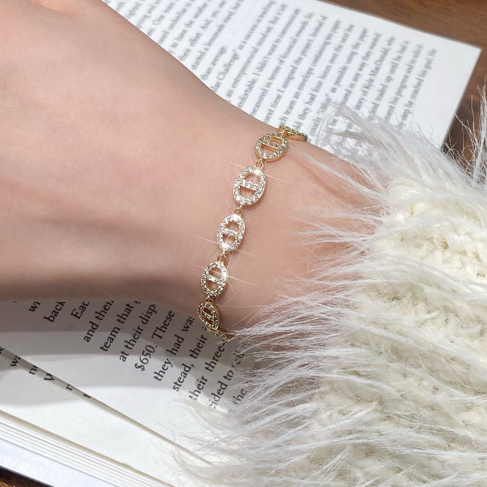 Clover micro-inlaid zircon hollowed-out bracelet