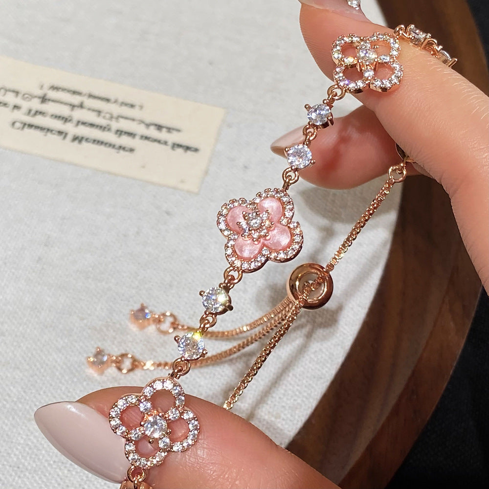 Clover micro-inlaid zircon hollowed-out bracelet
