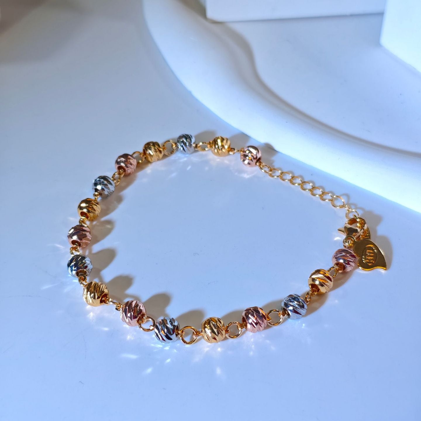 Copper gold-plated beaded bracelet with curved knife beads
