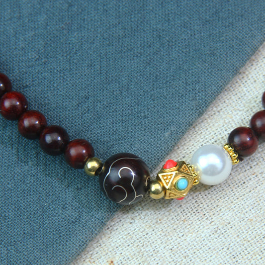 A small-leaf red sandalwood bracelet with silver inlaid around the clouds