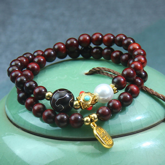 A small-leaf red sandalwood bracelet with silver inlaid around the clouds