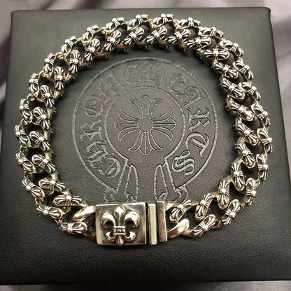 The S925 bracelet features a sword, anchor and cross flower