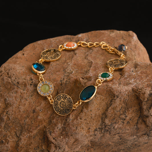 Classical multi-color oval gemstone electroplated, hollowed-out and diamond-encrusted vintage bracelet