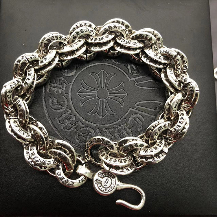 The S925 bracelet features a sword, anchor and cross flower