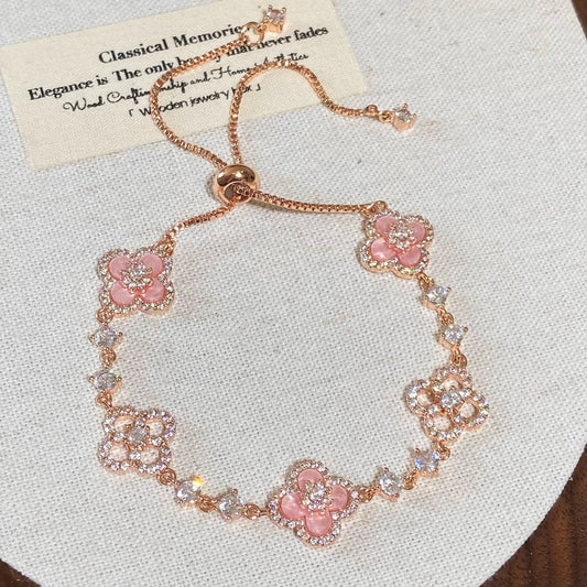 Clover micro-inlaid zircon hollowed-out bracelet