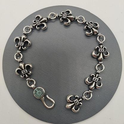 The S925 bracelet features a sword, anchor and cross flower