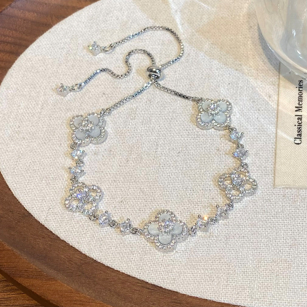 Clover micro-inlaid zircon hollowed-out bracelet