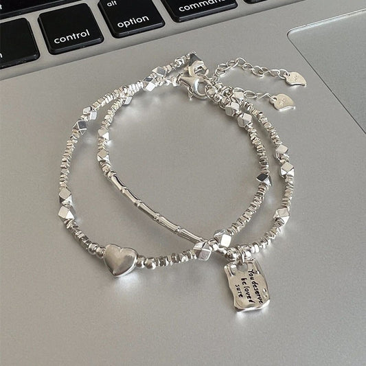 A few pairs of irregularly broken silver bracelets with heart-shaped square brand bamboo joints