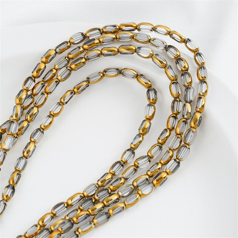 DIY loose bead handcrafted bracelet with transparent crystal glass surface and golden edge oval rice grain beads
