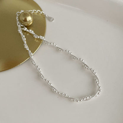 The S925 silver woven double-layer wound bracelet glitters with round beads