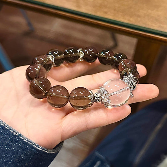 A 12mm single-ring bracelet made of natural tea crystal paired with white crystal