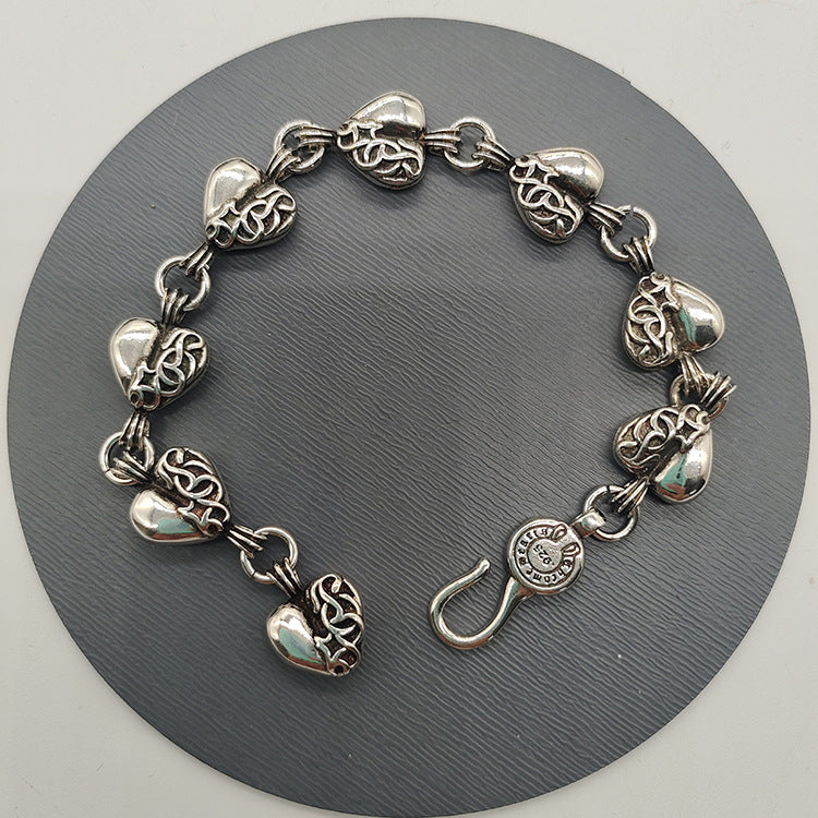 The S925 bracelet features a sword, anchor and cross flower