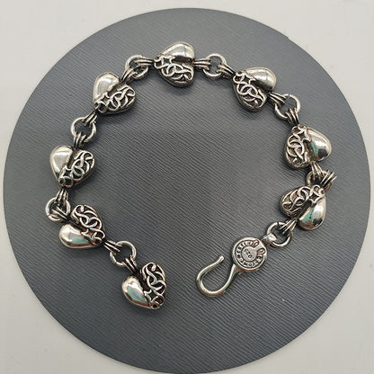 The S925 bracelet features a sword, anchor and cross flower
