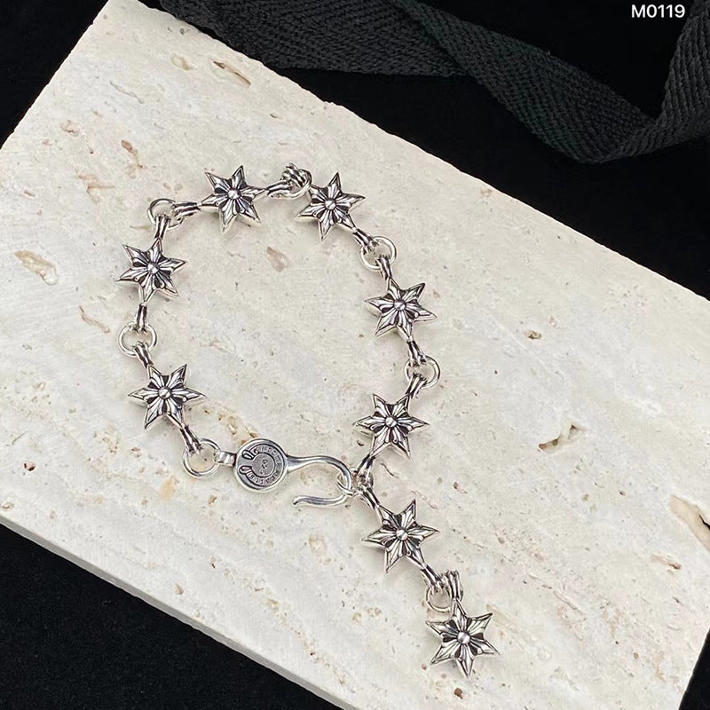 The S925 bracelet features a sword, anchor and cross flower