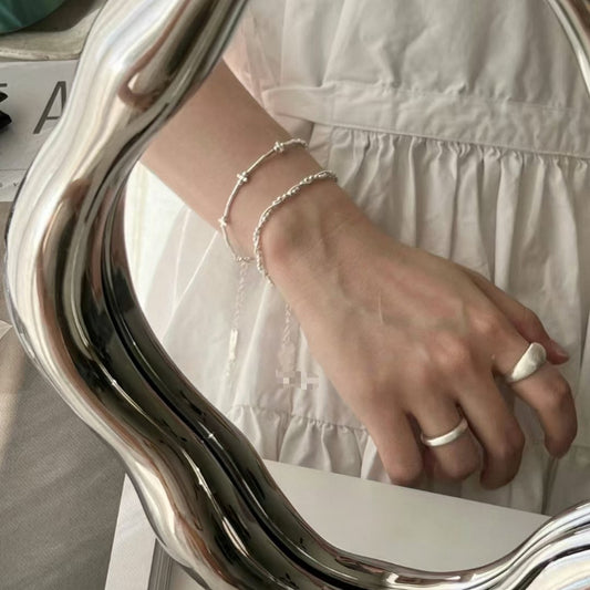 The S925 silver woven double-layer wound bracelet glitters with round beads
