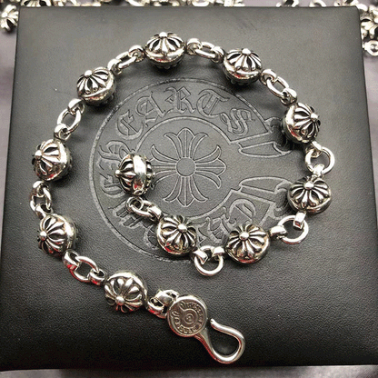 The S925 bracelet features a sword, anchor and cross flower
