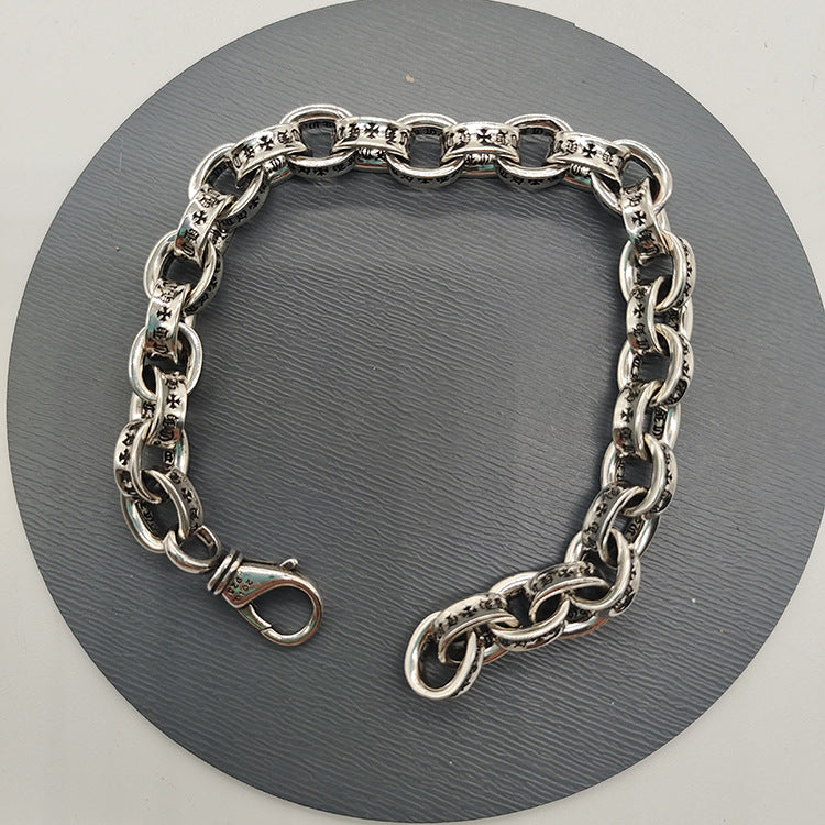 The S925 bracelet features a sword, anchor and cross flower