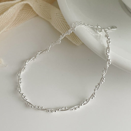 The S925 silver woven double-layer wound bracelet glitters with round beads