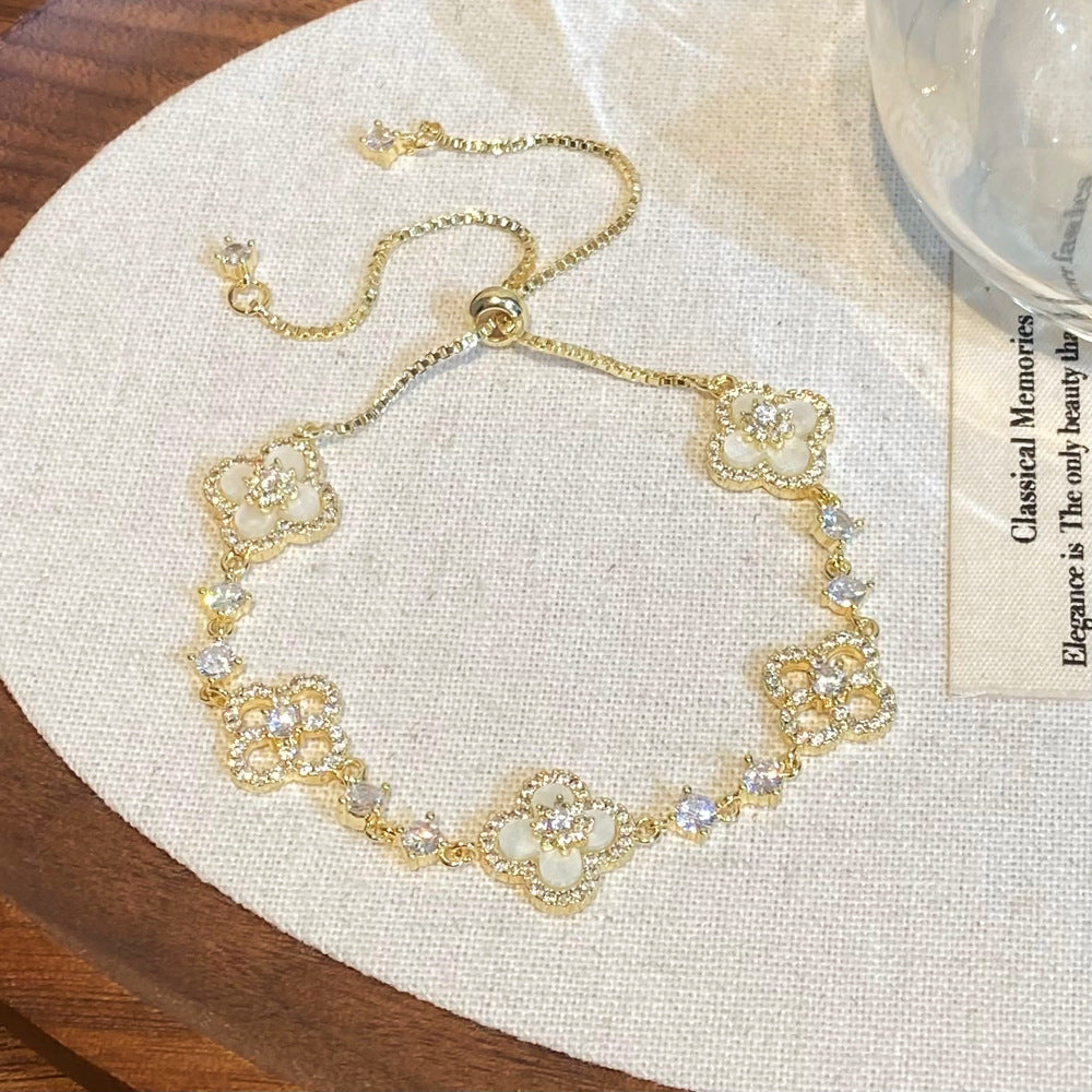 Clover micro-inlaid zircon hollowed-out bracelet
