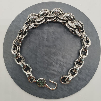 The S925 bracelet features a sword, anchor and cross flower