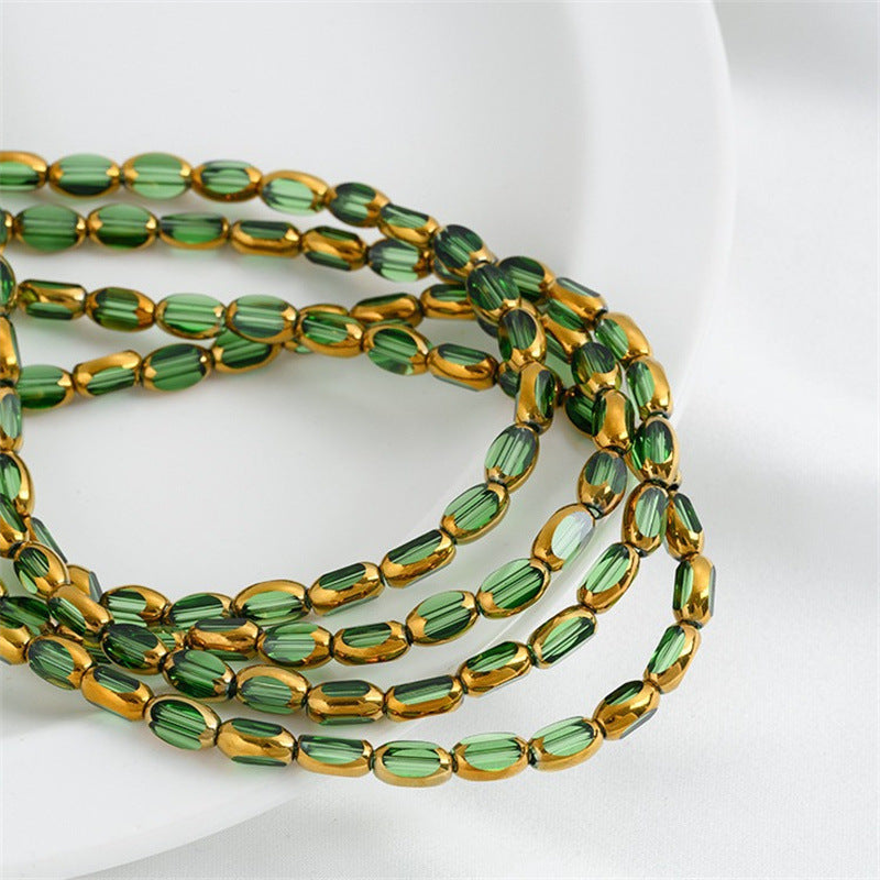 DIY loose bead handcrafted bracelet with transparent crystal glass surface and golden edge oval rice grain beads