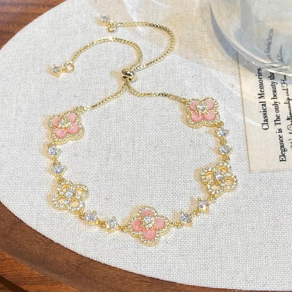 Clover micro-inlaid zircon hollowed-out bracelet