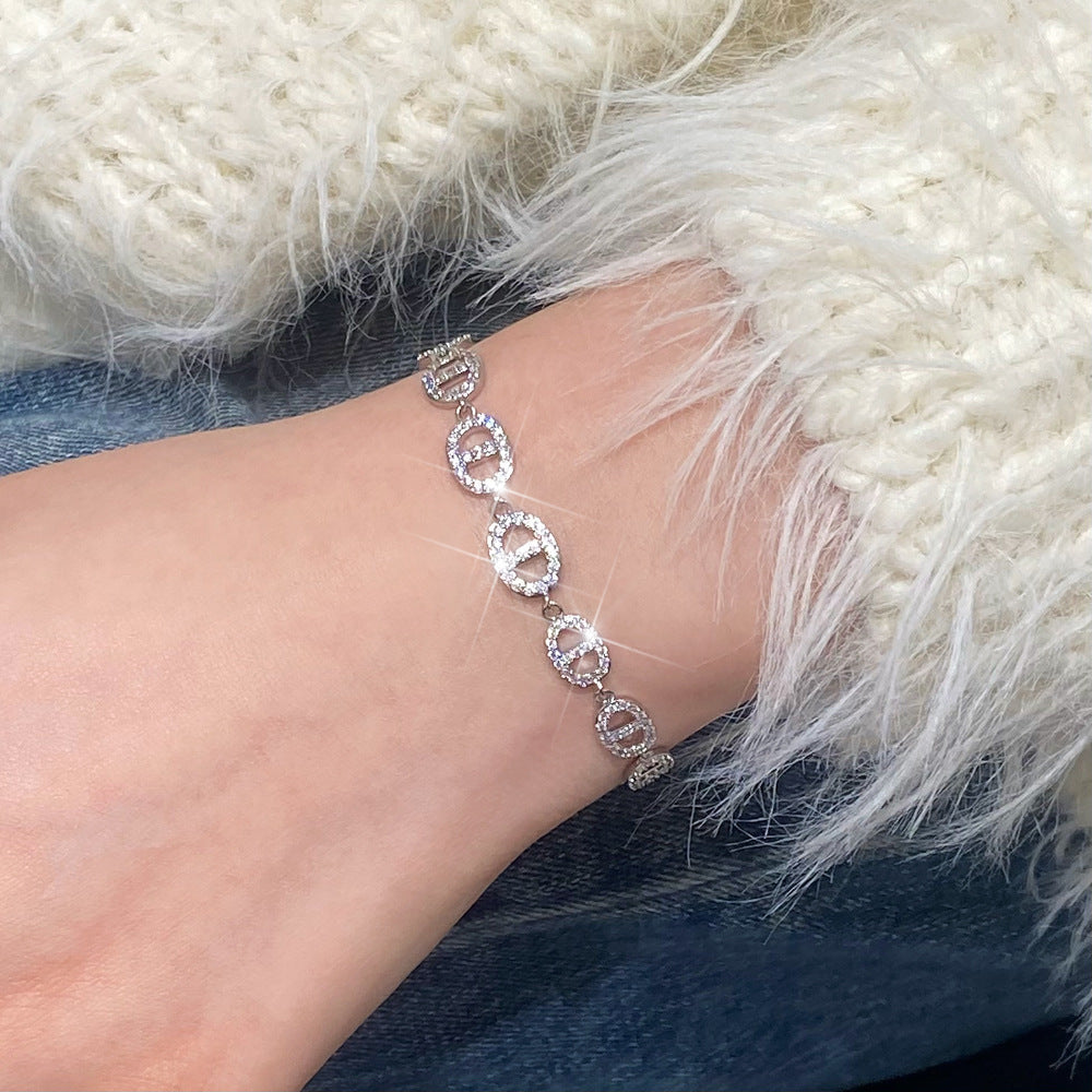 Clover micro-inlaid zircon hollowed-out bracelet