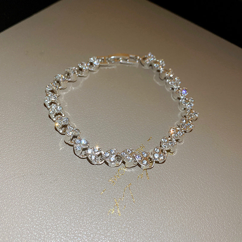 Diamond-encrusted heart-shaped personalized bracelet