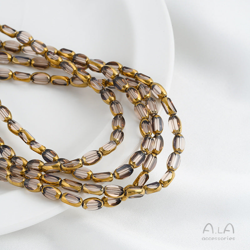 DIY loose bead handcrafted bracelet with transparent crystal glass surface and golden edge oval rice grain beads