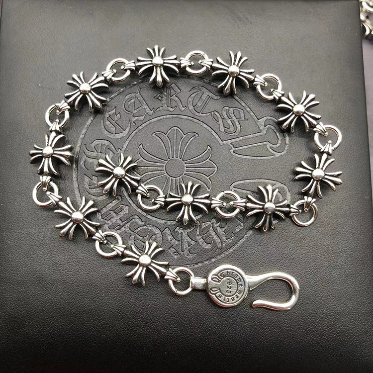 The S925 bracelet features a sword, anchor and cross flower