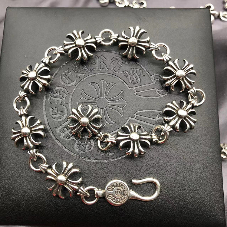 The S925 bracelet features a sword, anchor and cross flower