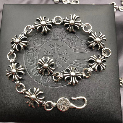 The S925 bracelet features a sword, anchor and cross flower